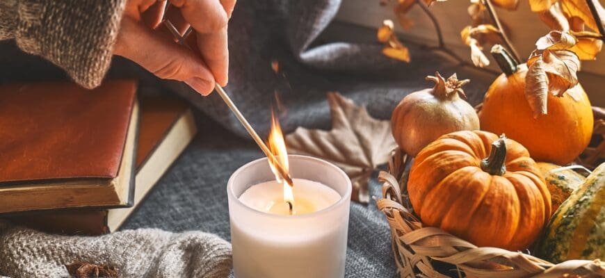 Hand,With,Burning,Match,Lighting,A,Candle,On,The,Windowsill